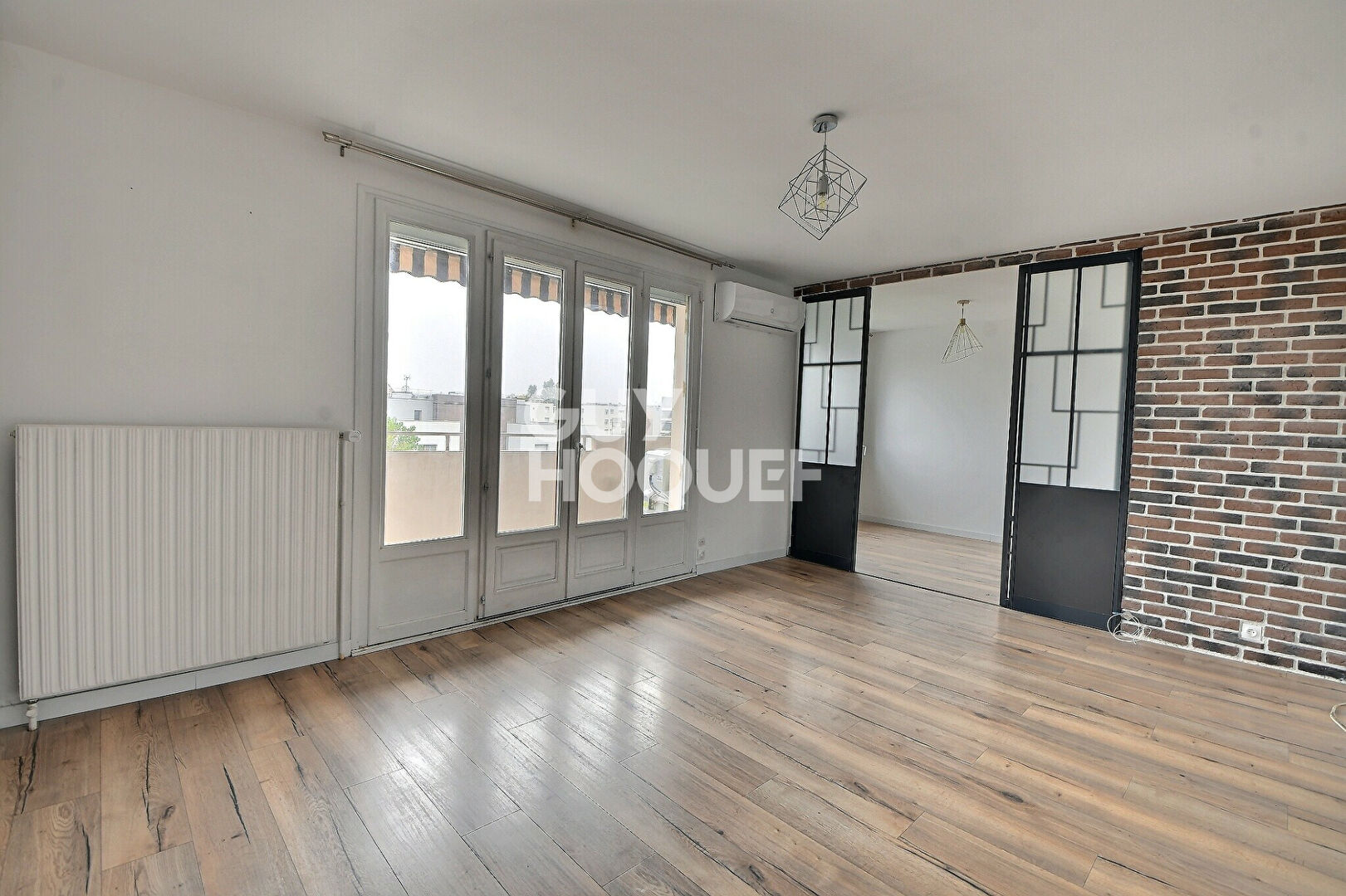 Appartement T4 de 73 m² avec balcon, parking et cave à Villeurbanne (69100).