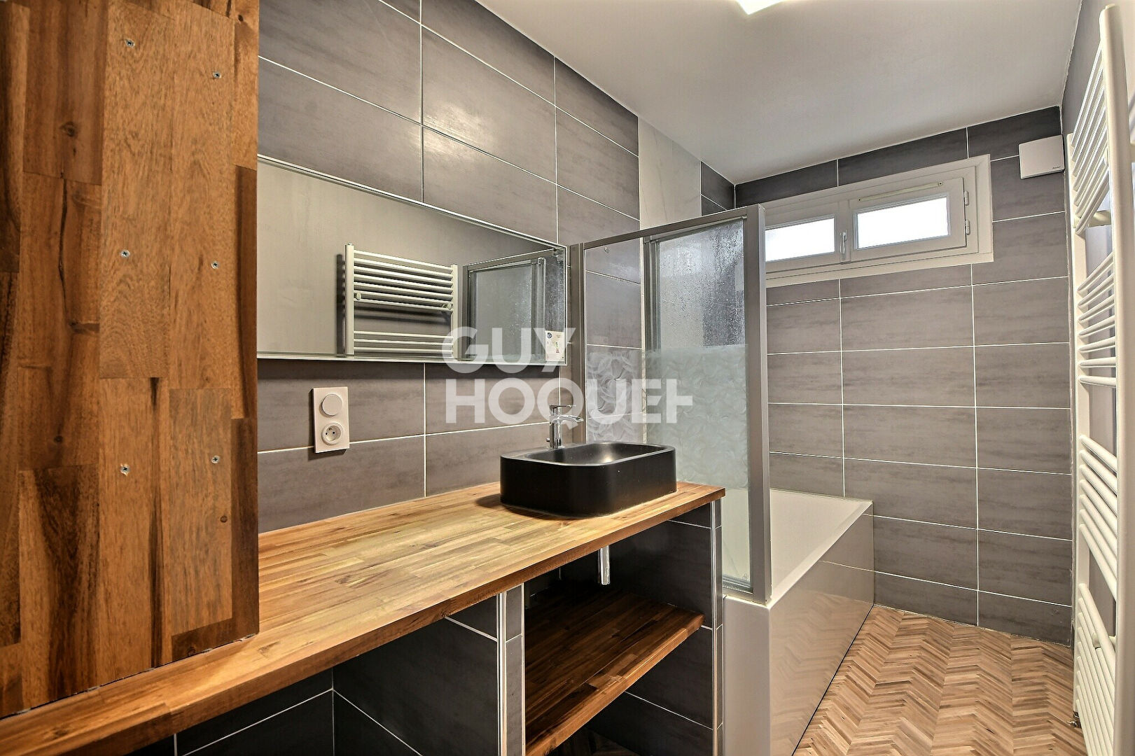 Appartement T4 de 73 m² avec balcon, parking et cave à Villeurbanne (69100).