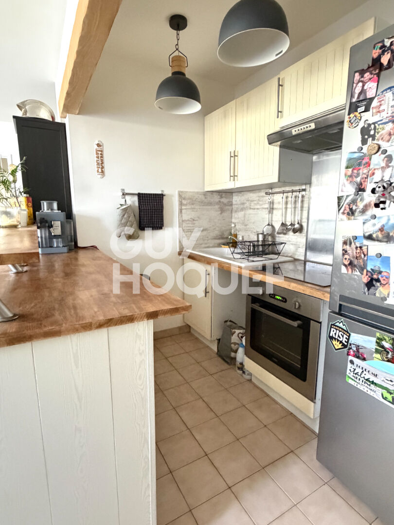 Appartement au Coudray-Montceaux avec box et place de parking
