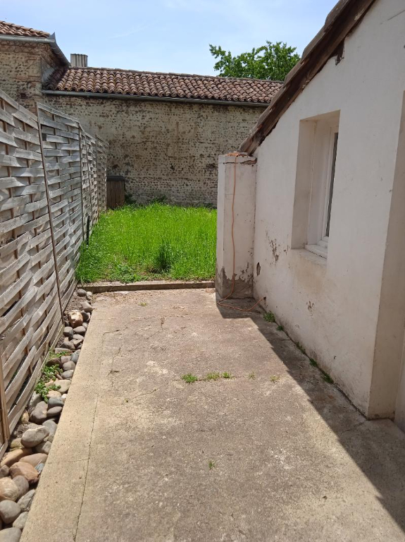 Maison de ville avec jardin, deux chambres