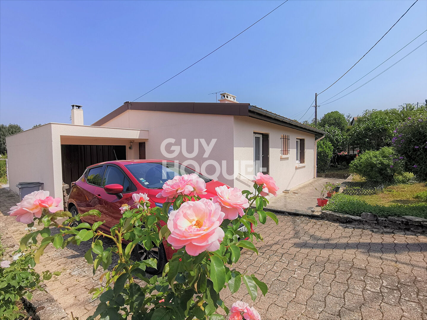 Belle maison de plain-pied avec jardin et garage à Bouvesse-Quirieu