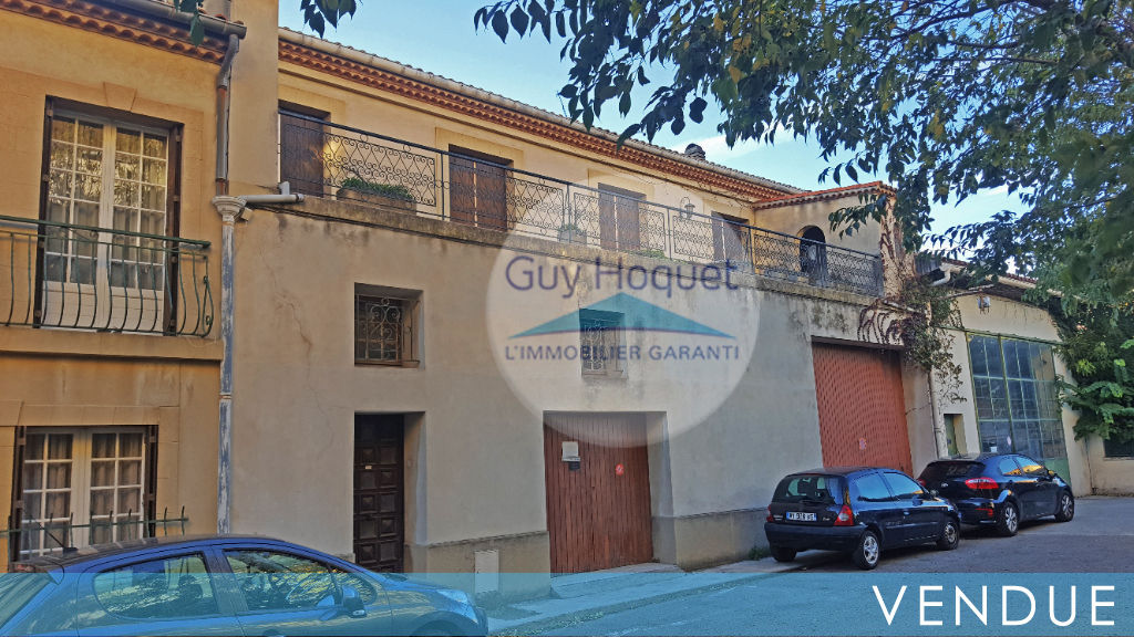 MAISON ET GARAGES-CENTRE VILLE