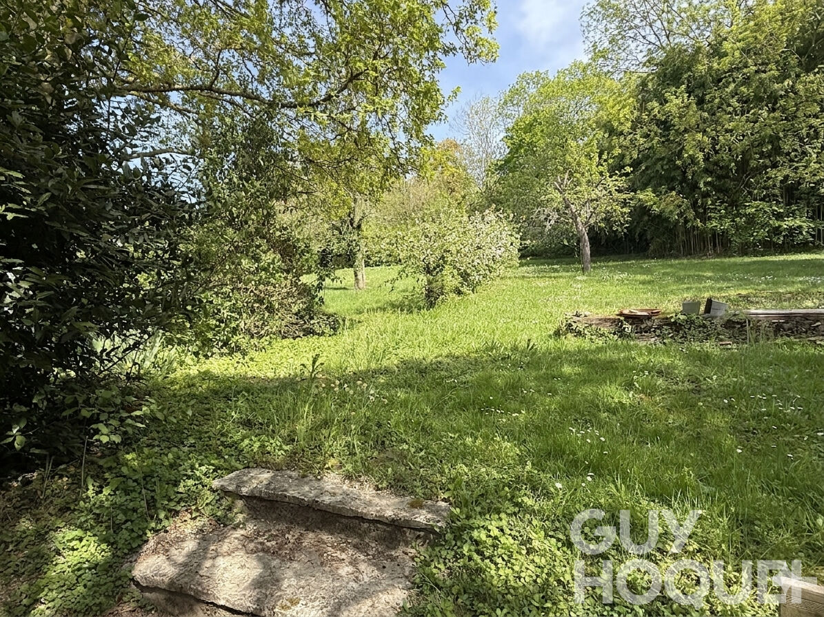 Maison avec jardin dans un cadre verdoyant
