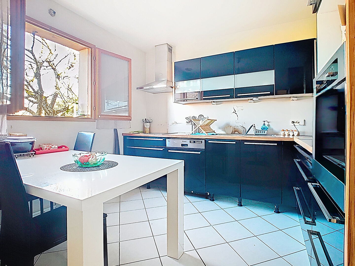 Modern kitchen in a property located in Haute-Savoie, Auvergne-Rhône-Alpes, featuring sleek cabinetry and natural light.