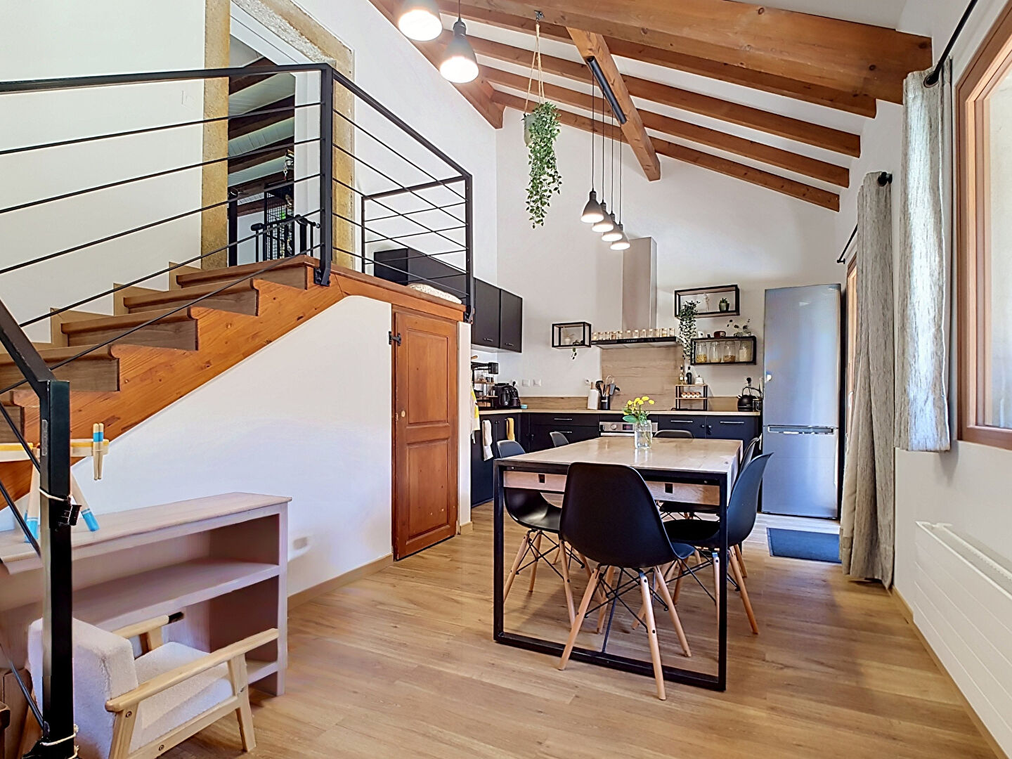Bright living room in a property located in Haute-Savoie, Auvergne-Rhône-Alpes, featuring wooden beams and modern furnishings