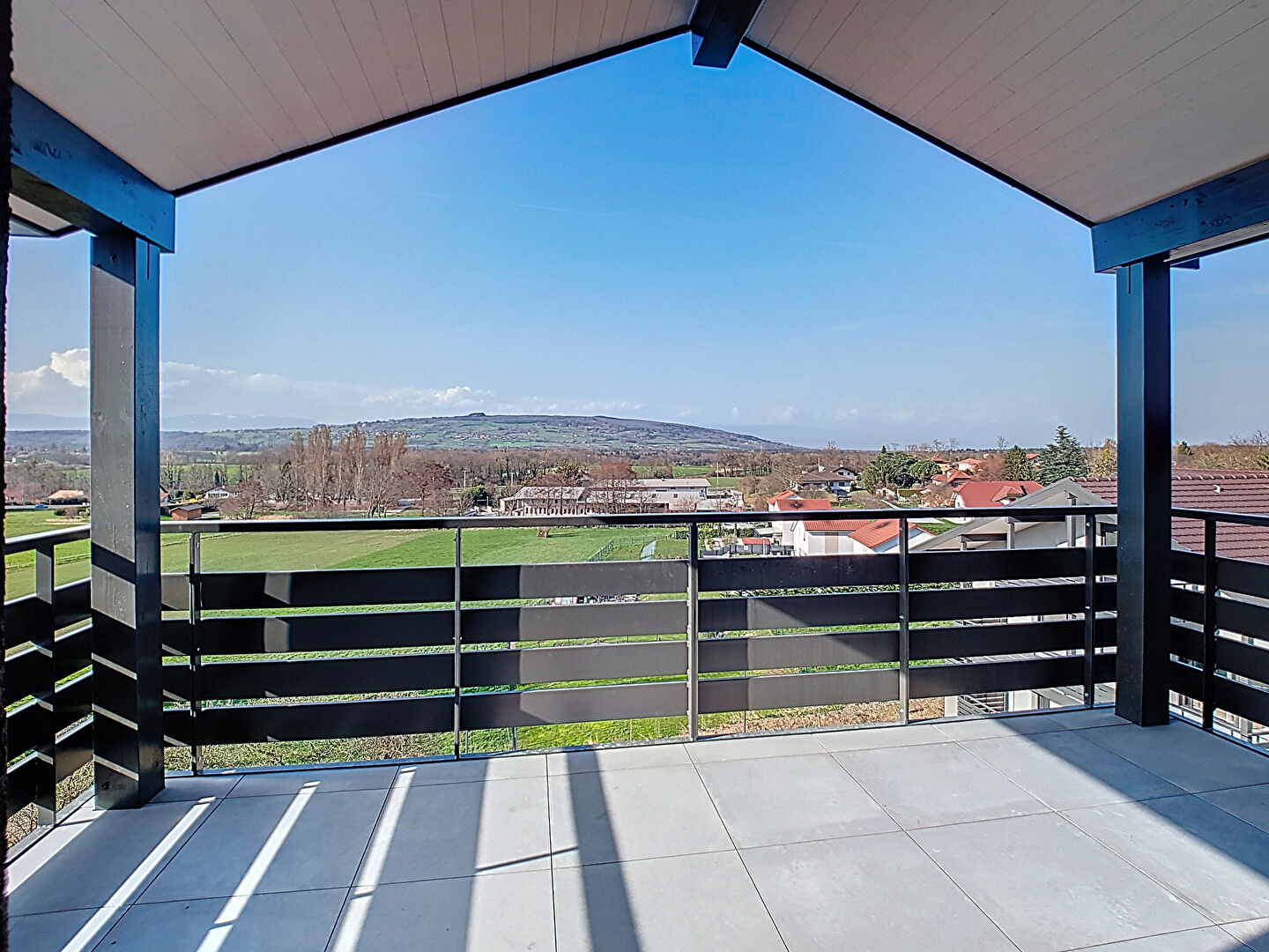 Modern property in Haute-Savoie with a spacious terrace and panoramic views of the surrounding landscape.