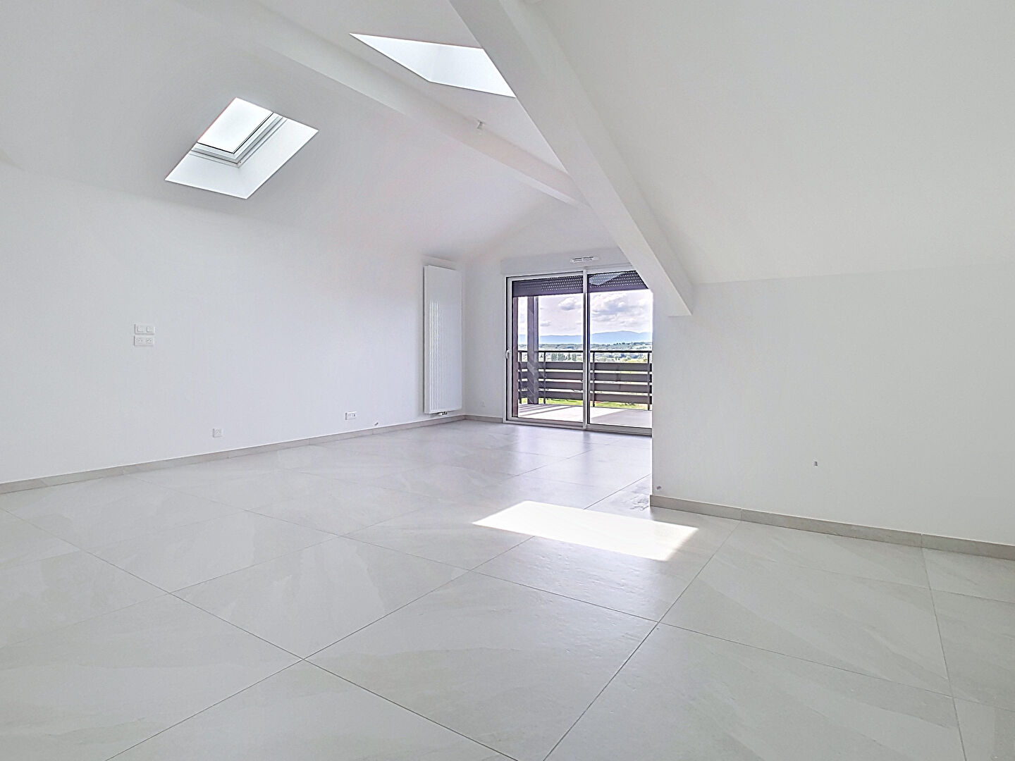 Spacious property in Haute-Savoie featuring large windows and natural light. Ideal for modern living in Auvergne-Rhône-Alpes.