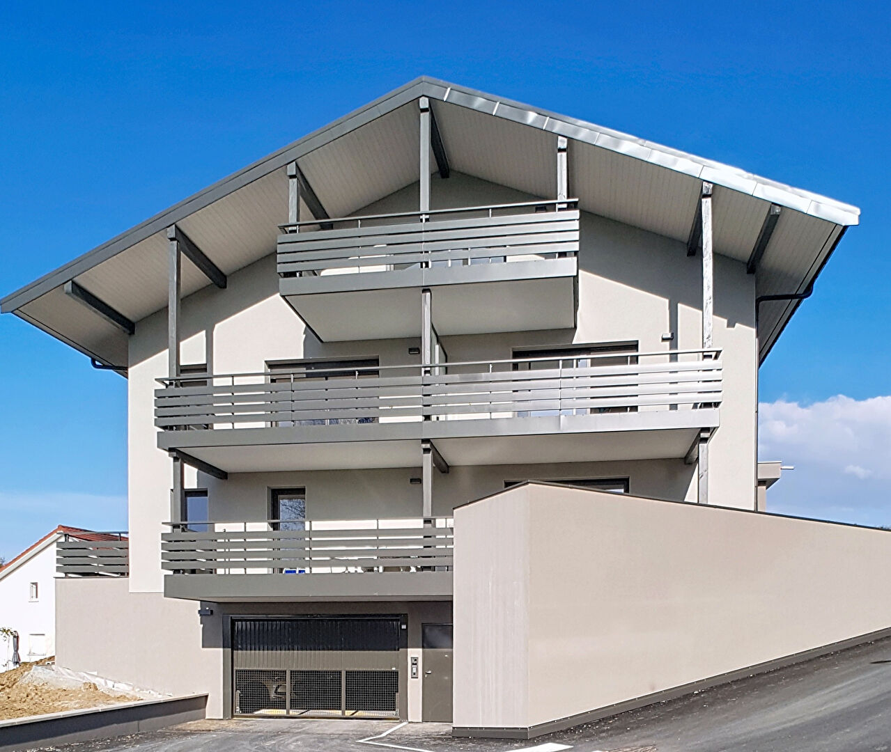 Modern property in Haute-Savoie, Auvergne-Rhône-Alpes, featuring balconies and a contemporary design.