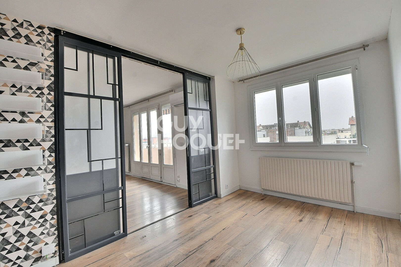 Appartement T4 de 73 m² avec balcon, parking et cave à Villeurbanne (69100).