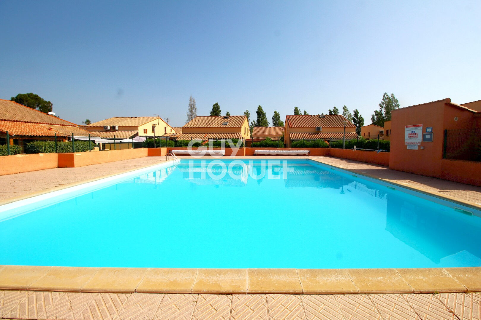 Maison T2 en copropriété  + véranda + parking privatif à acquérir en su