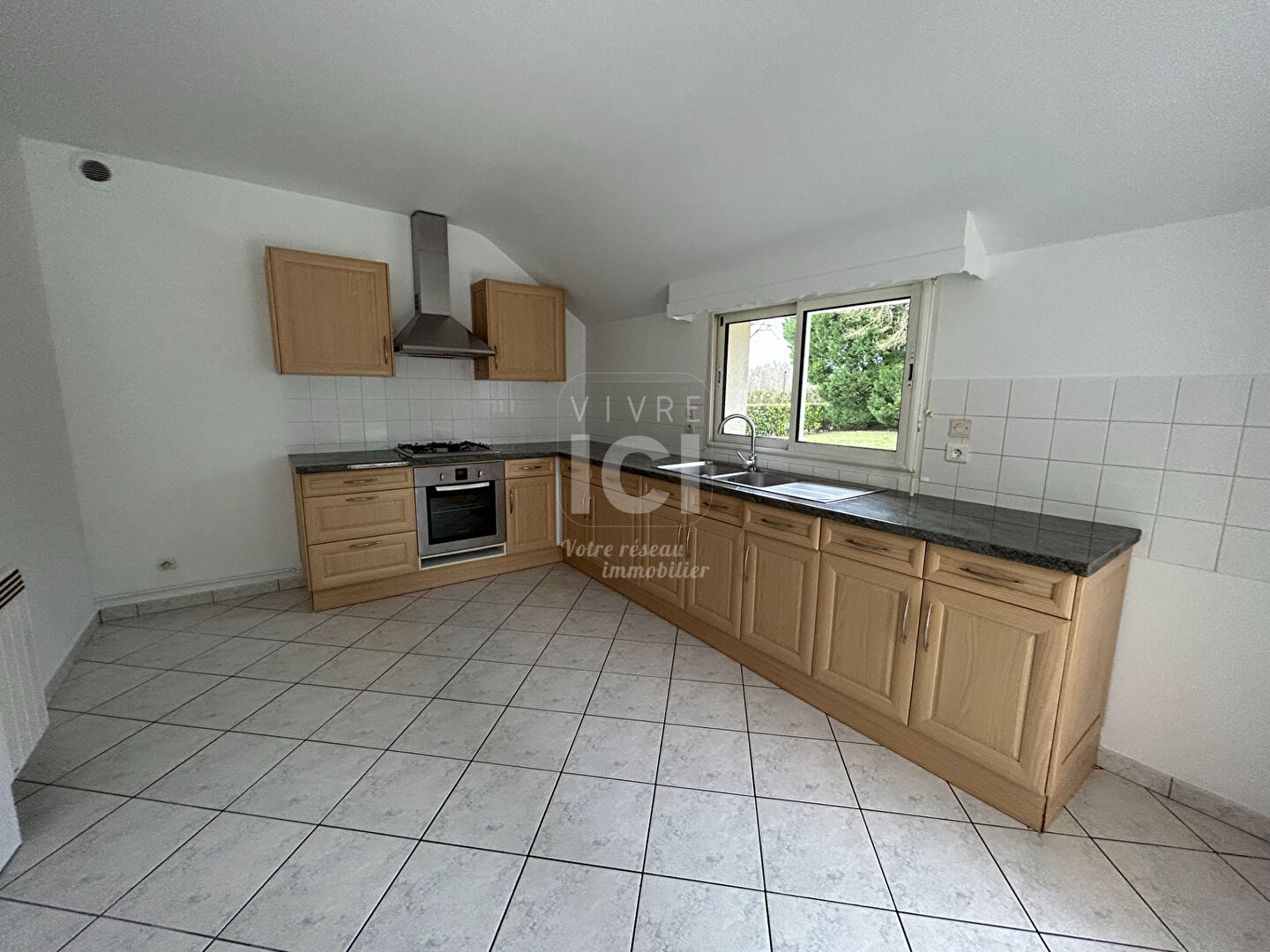 Photo A louer - Maison Treillières 4 pièce(s) 90 m2 avec jardin et garage image 2/6