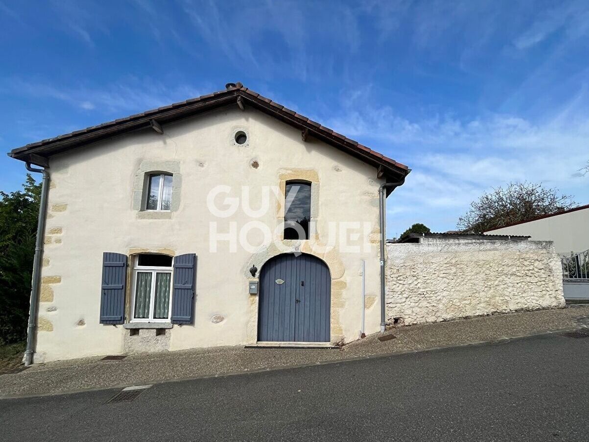 Maison avec possibilité d'agrandissement et jardin