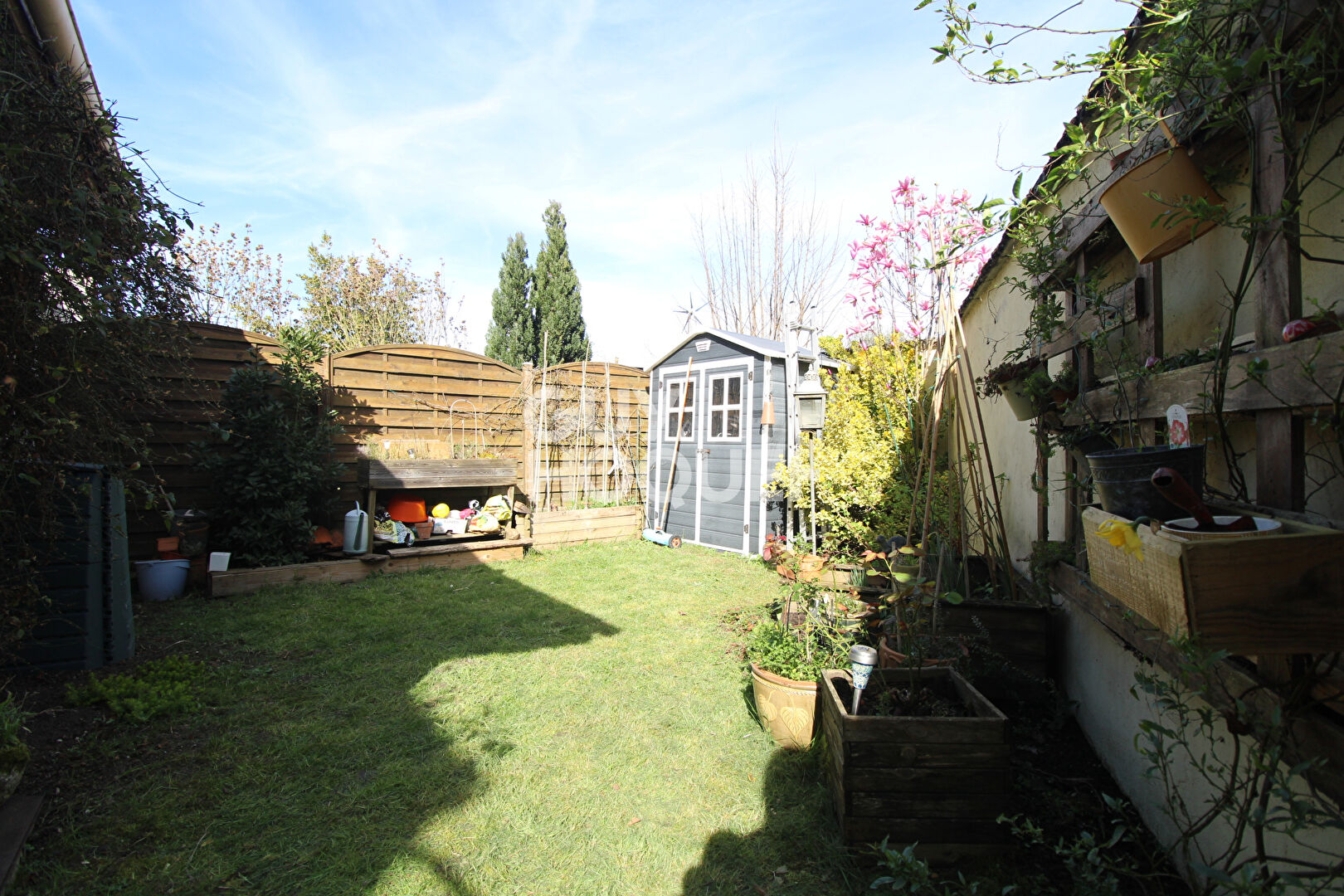 Appartement F4 avec jardin et garage