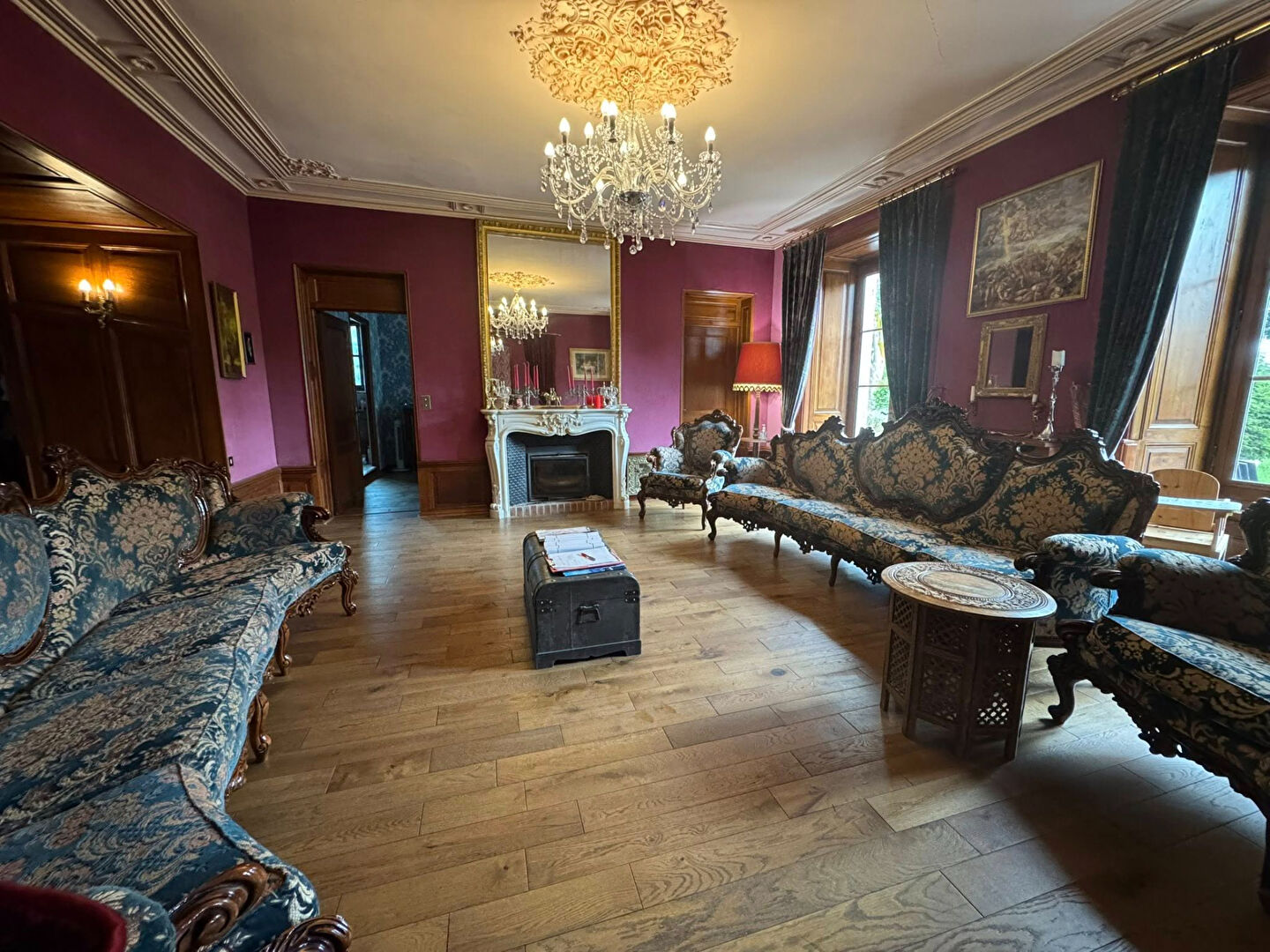 Elegant interior of a property in Haute-Vienne, Nouvelle-Aquitaine, featuring ornate furniture and wooden flooring.