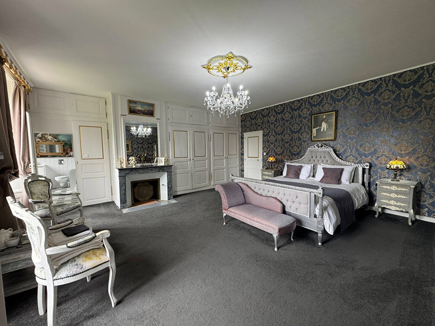 Luxurious property in Haute-Vienne featuring a spacious bedroom with stylish decor and elegant furnishings.