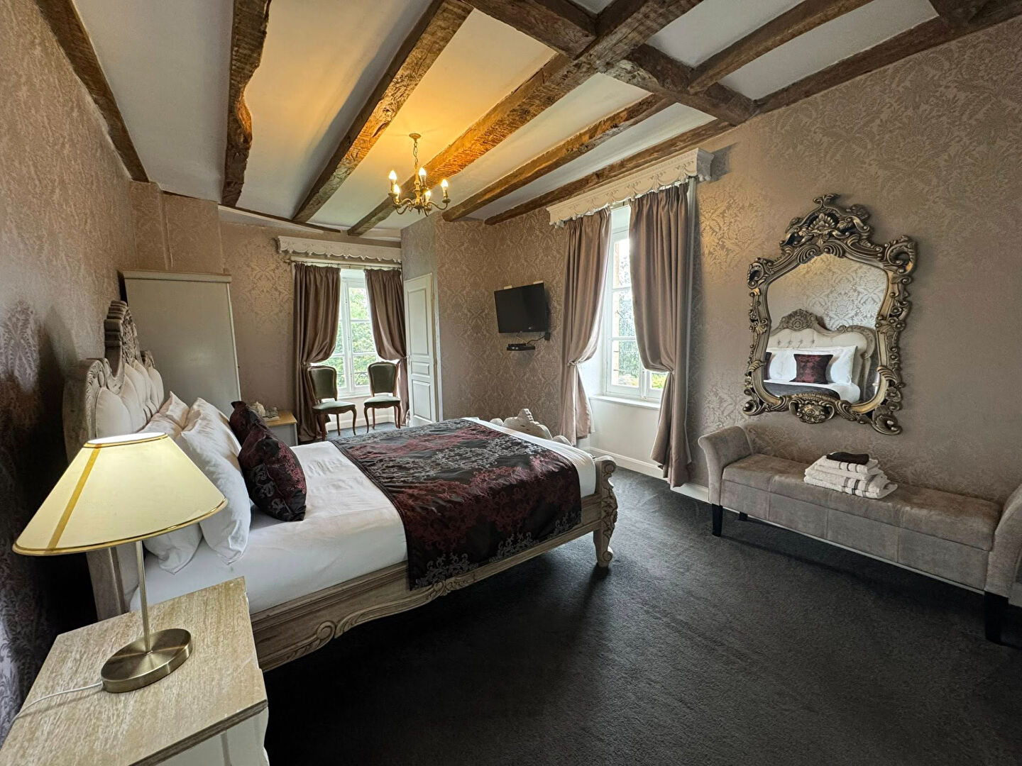 Luxurious property in Haute-Vienne, Nouvelle-Aquitaine, featuring a spacious bedroom with ornate decor and natural light.