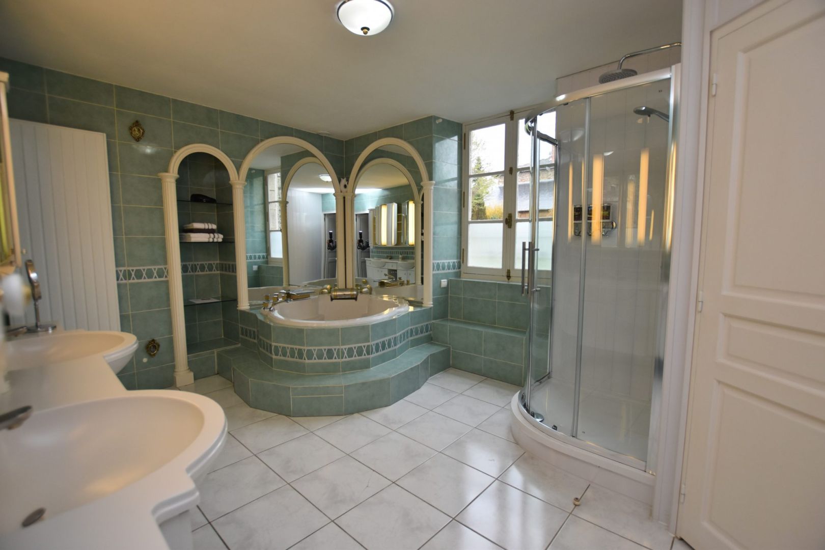 Luxurious bathroom featuring a spa bath and separate shower in Haute-Vienne, Nouvelle-Aquitaine property.