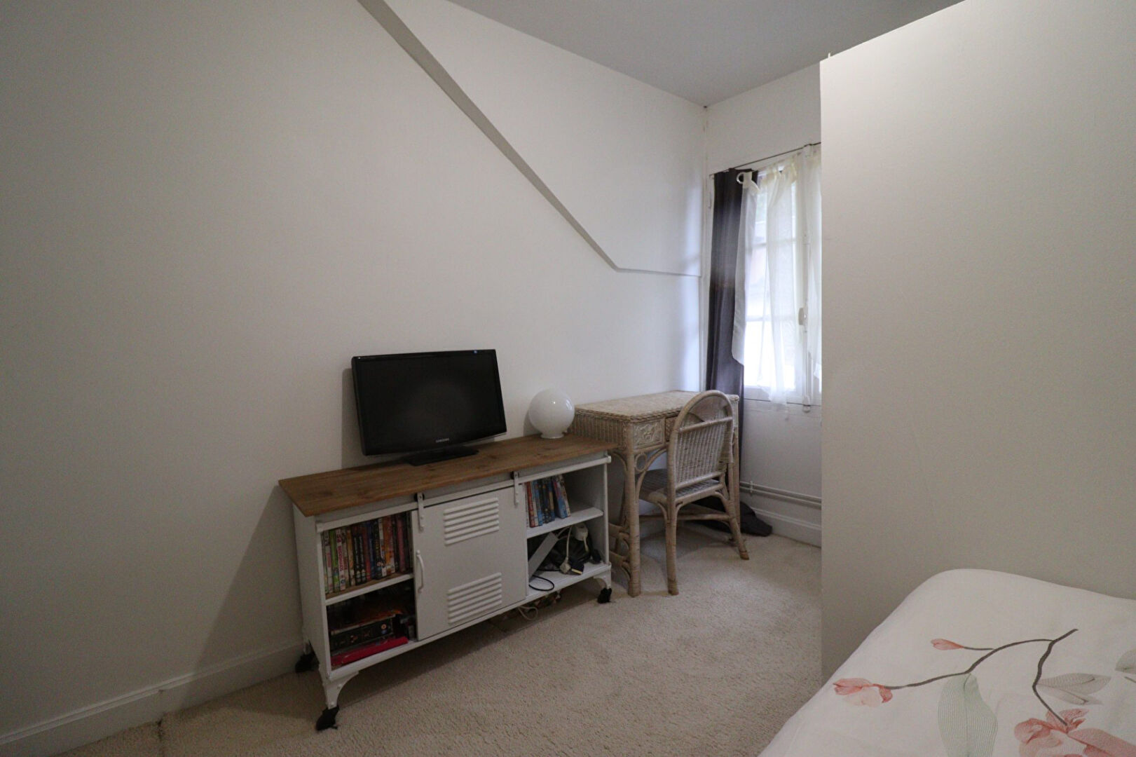 Five-bedroom property in Corrèze, Nouvelle-Aquitaine, featuring a light-filled room with a television and desk.