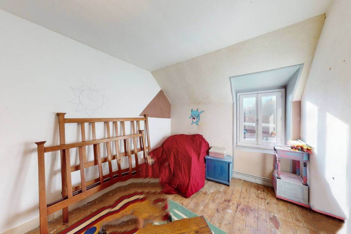 5-bedroom property in Creuse, Nouvelle-Aquitaine, featuring sloped ceilings and wooden flooring.