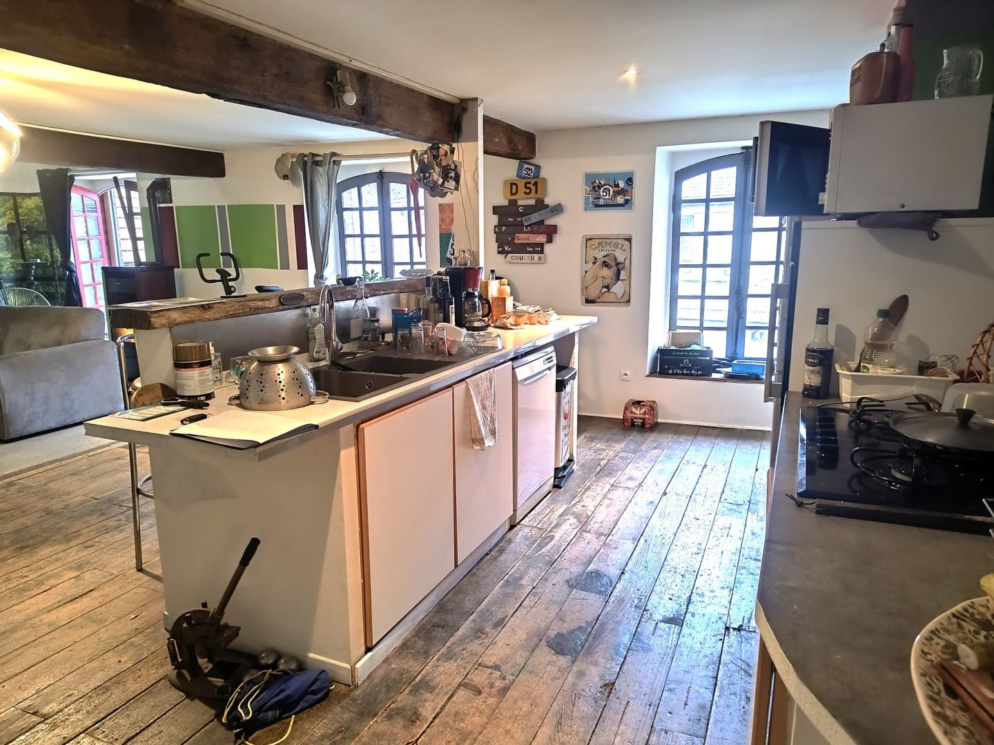 Spacious kitchen in a property, featuring wooden floors and large windows in Creuse, Nouvelle-Aquitaine, 23300.