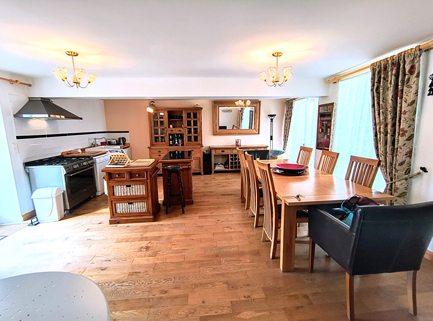 Spacious property in Creuse, Nouvelle-Aquitaine featuring a large dining area and modern kitchen elements.