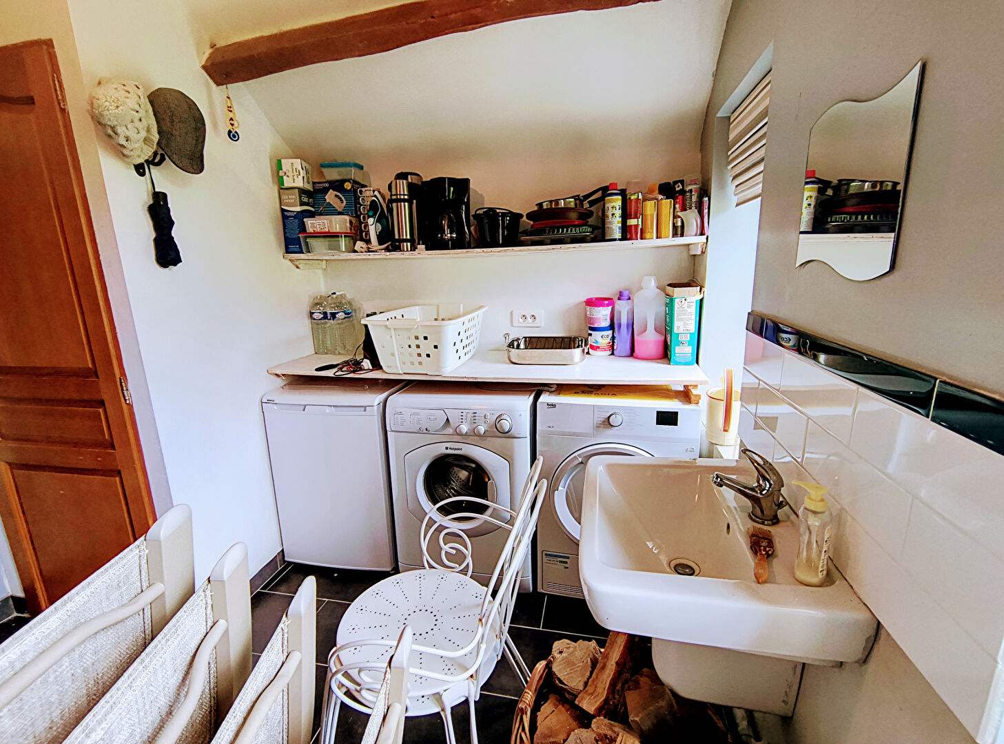 Utility room with washing machines, storage shelves, and sink in Creuse, Nouvelle-Aquitaine, 23300. Property type: property.