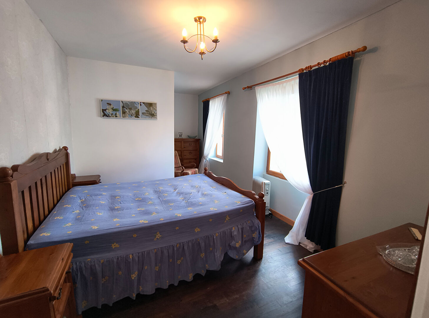 Spacious bedroom featuring wooden furniture in a property located in Creuse, Nouvelle-Aquitaine.