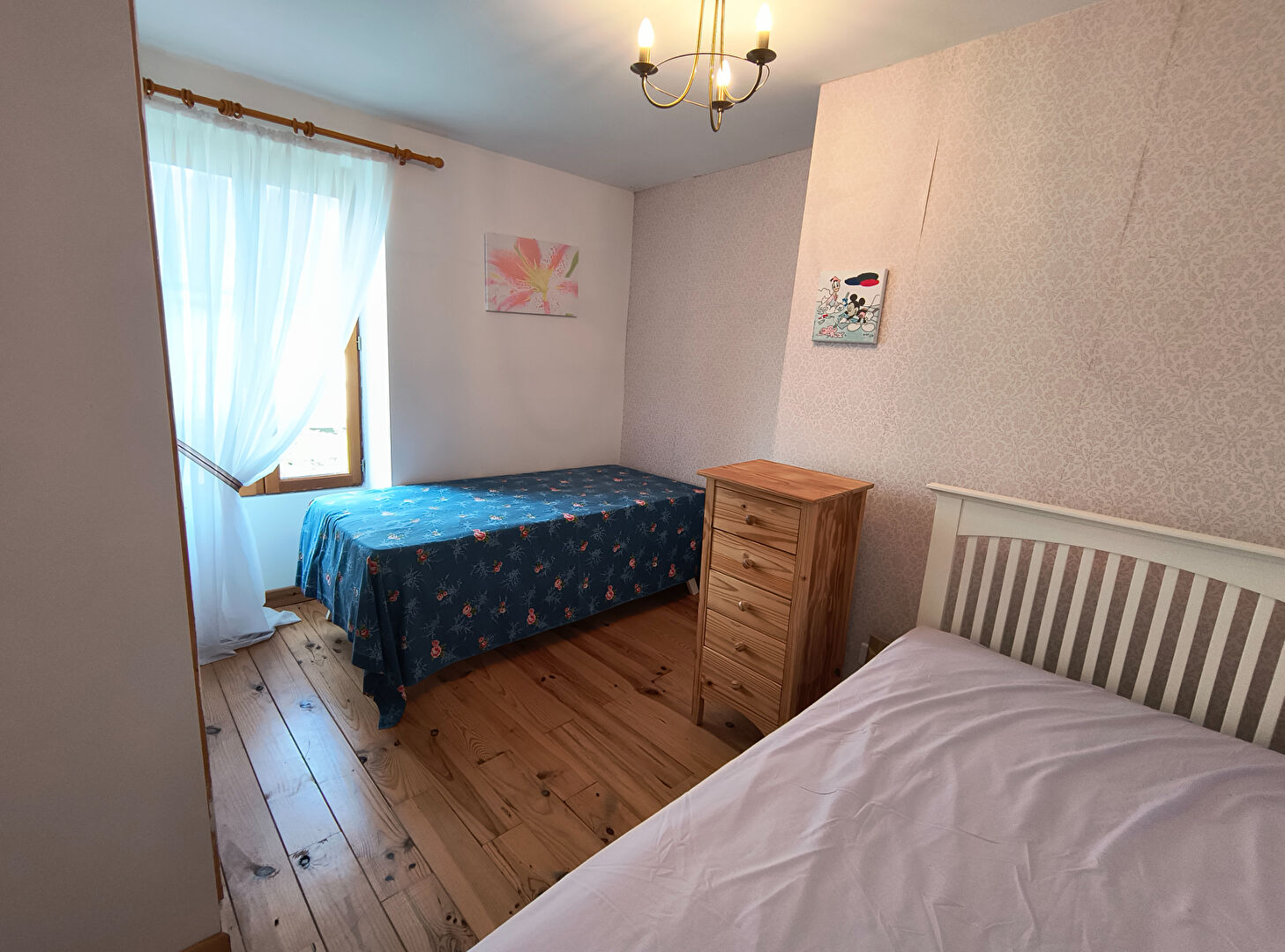 Four-bedroom property in Creuse, Nouvelle-Aquitaine, featuring wooden floors and natural light from the window.