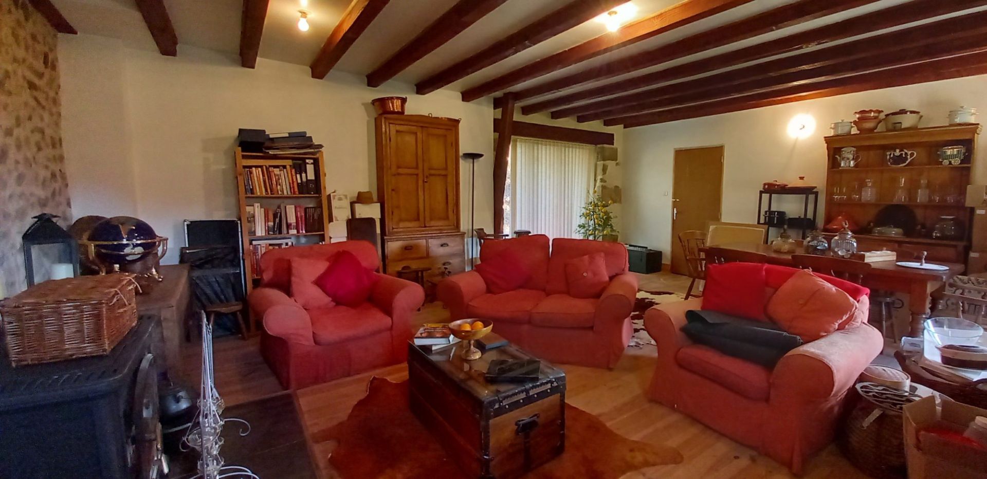 Spacious living area with three bedrooms, located in Haute-Vienne, Nouvelle-Aquitaine, featuring exposed beams and cosy