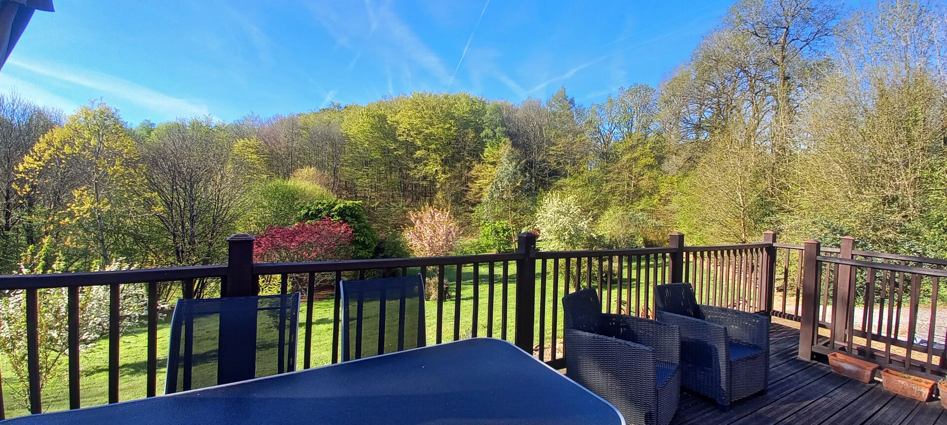 Terrace with seating overlooking lush greenery in Haute-Vienne, Nouvelle-Aquitaine, featuring a three-bedroom property.