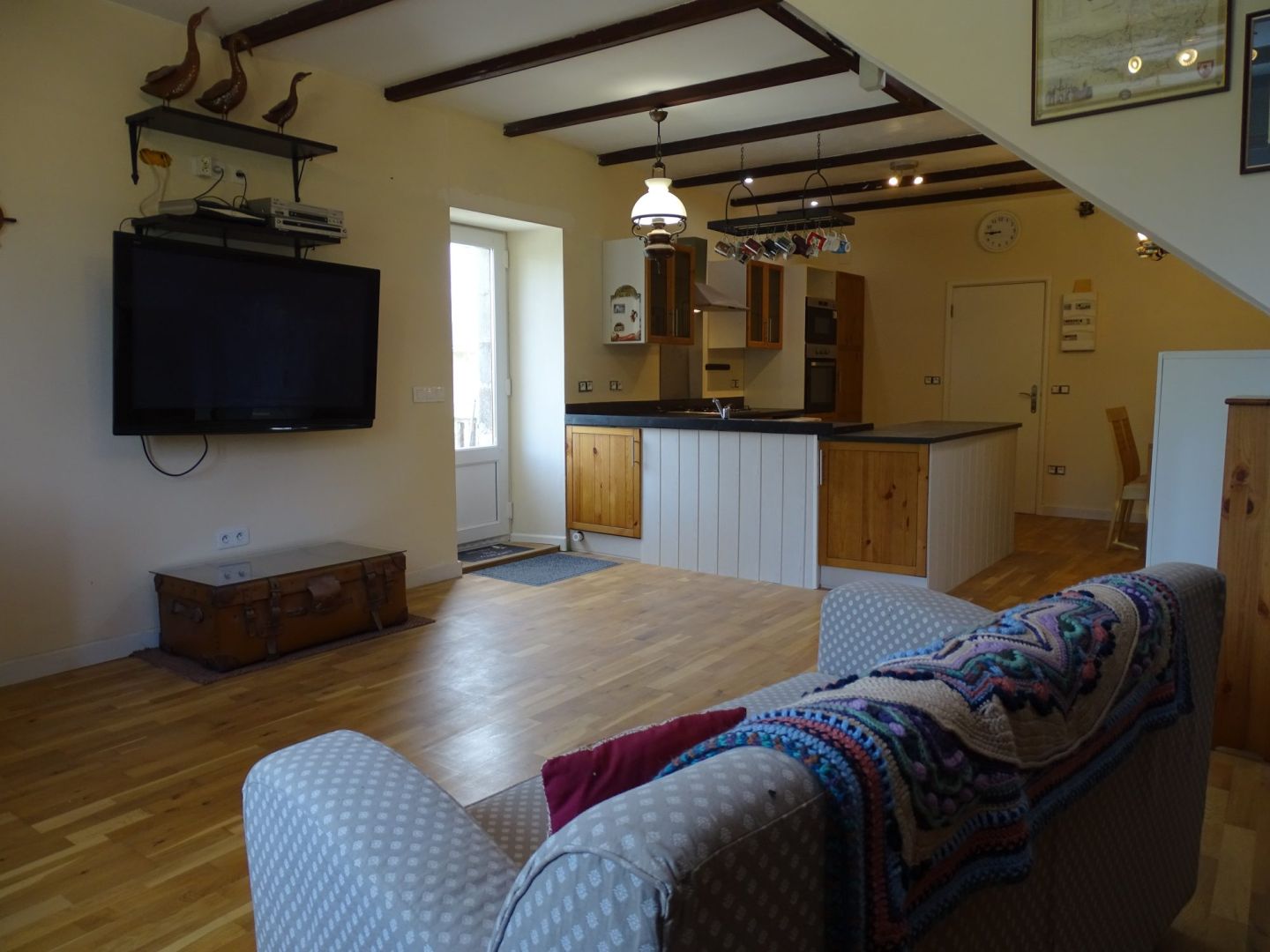 Spacious 3-bedroom property in Côtes-d'Armor, Brittany, featuring wooden beams and an open kitchen area.
