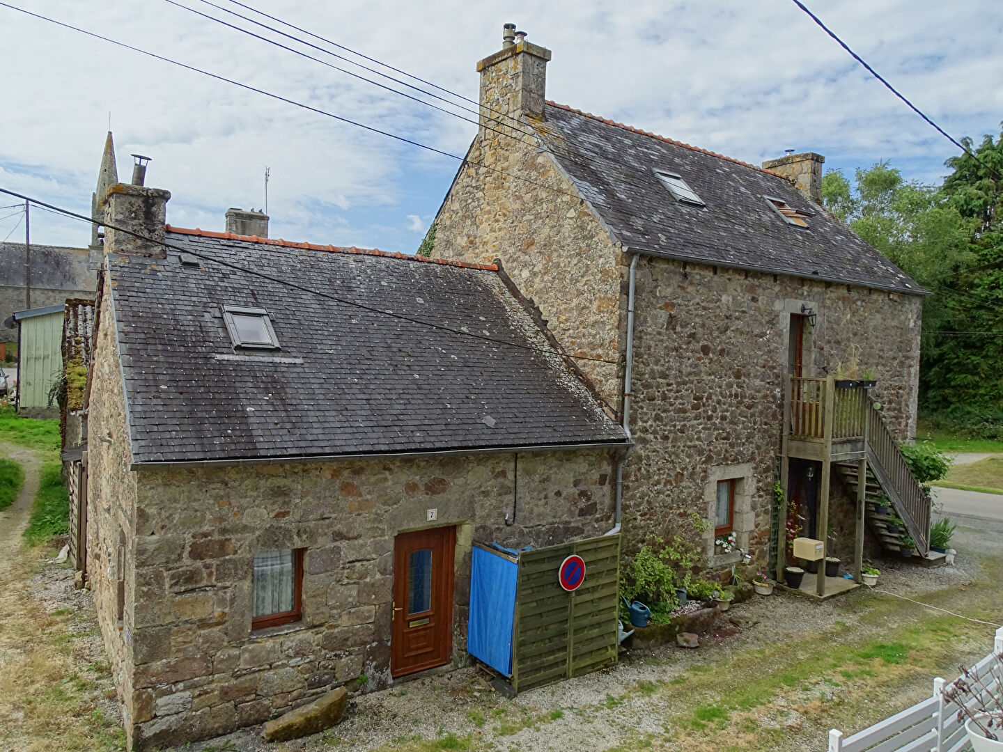 Stone property in Côtes-d'Armor, Brittany, featuring three bedrooms and rustic exterior with garden access.