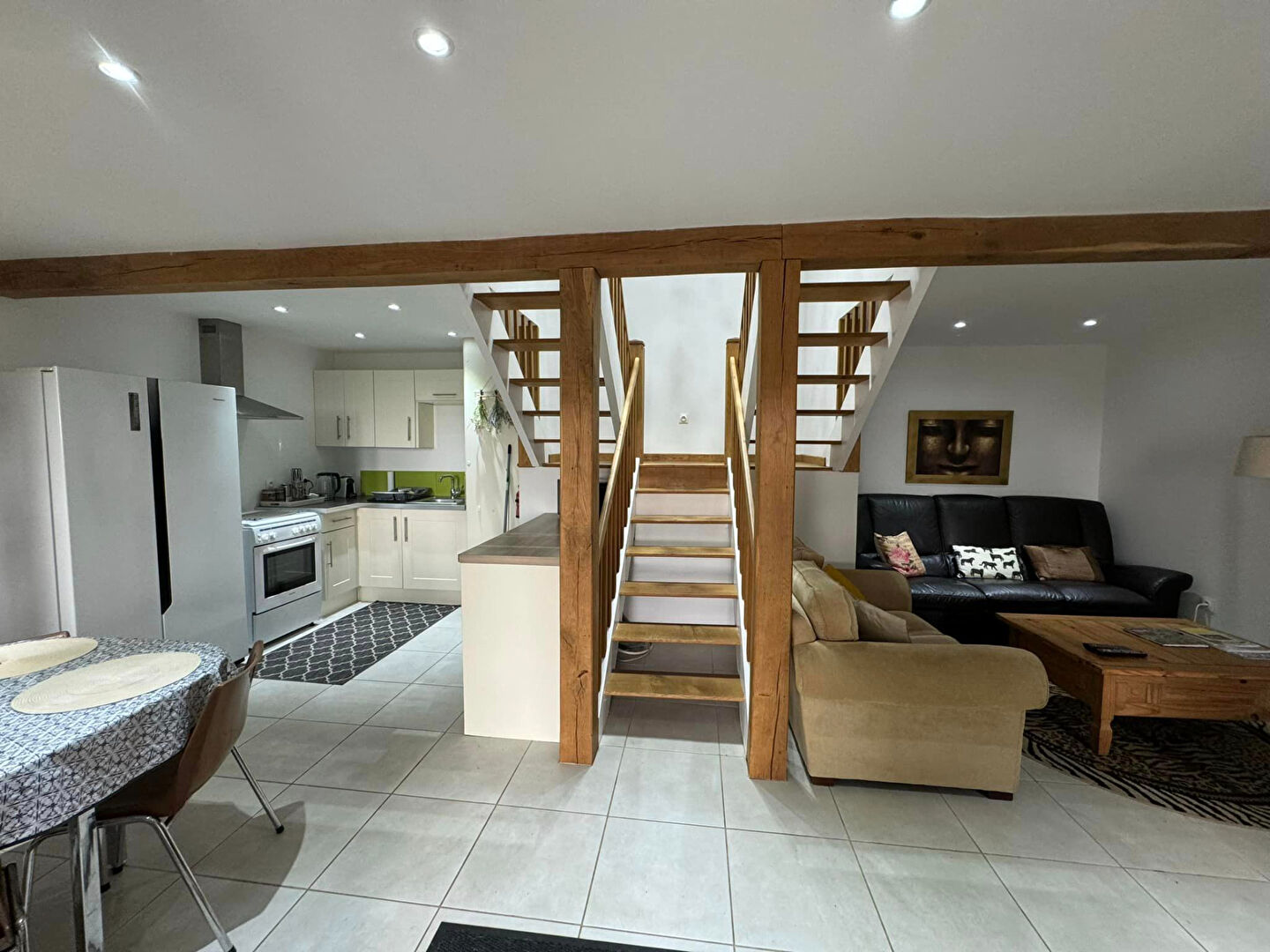 Spacious property in Haute-Vienne, Nouvelle-Aquitaine, featuring a modern kitchen and living area with wooden beams.