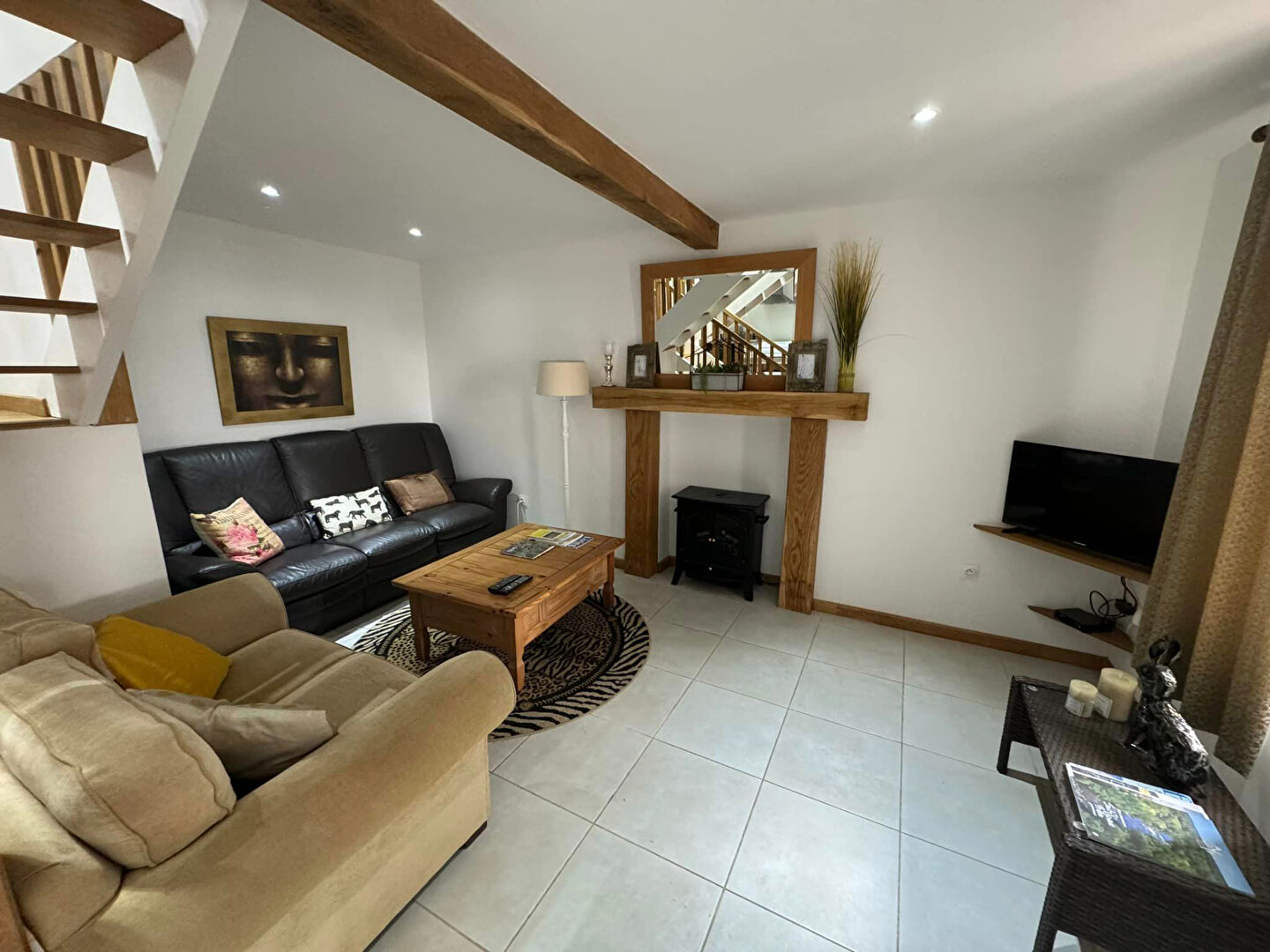 Spacious property in Haute-Vienne with modern living area, wooden beams, and natural light.
