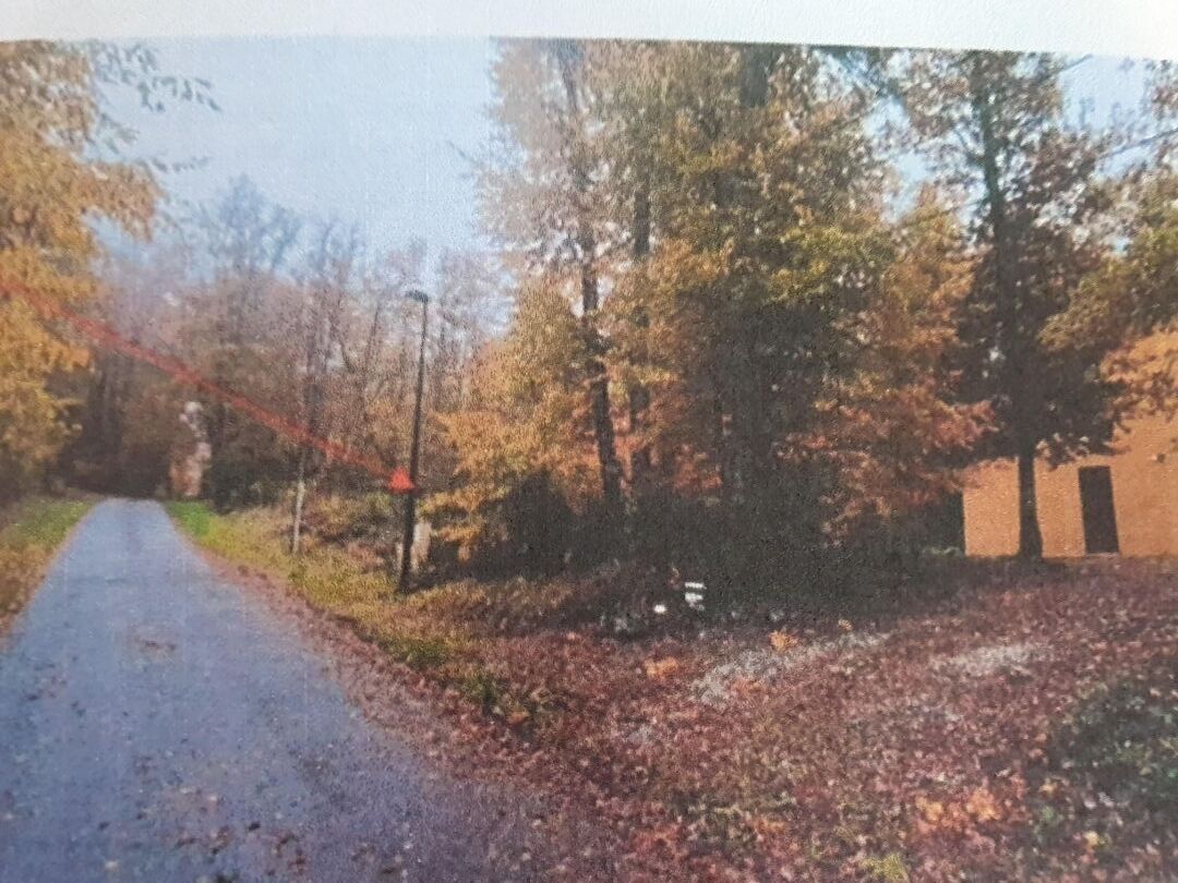 3-bedroom property located in Corrèze, Nouvelle-Aquitaine, surrounded by trees and autumn foliage along a pathway.