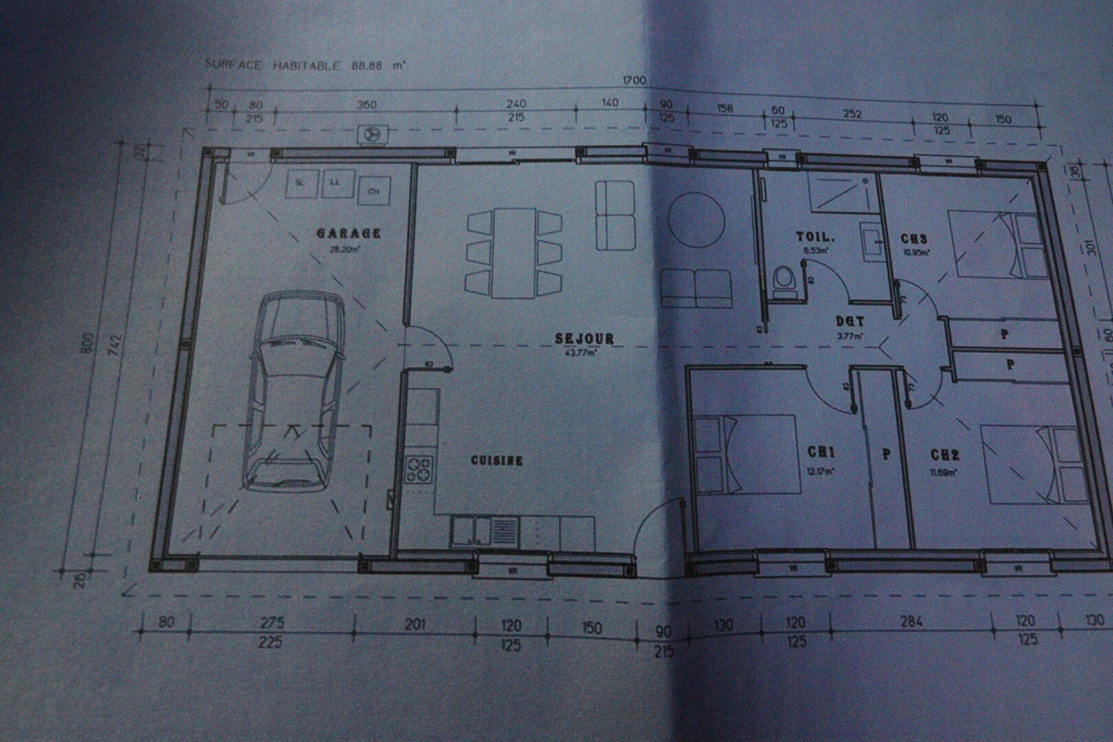 3-bedroom property floor plan in Corrèze, Nouvelle-Aquitaine, showcasing garage, living area, and kitchen layout.