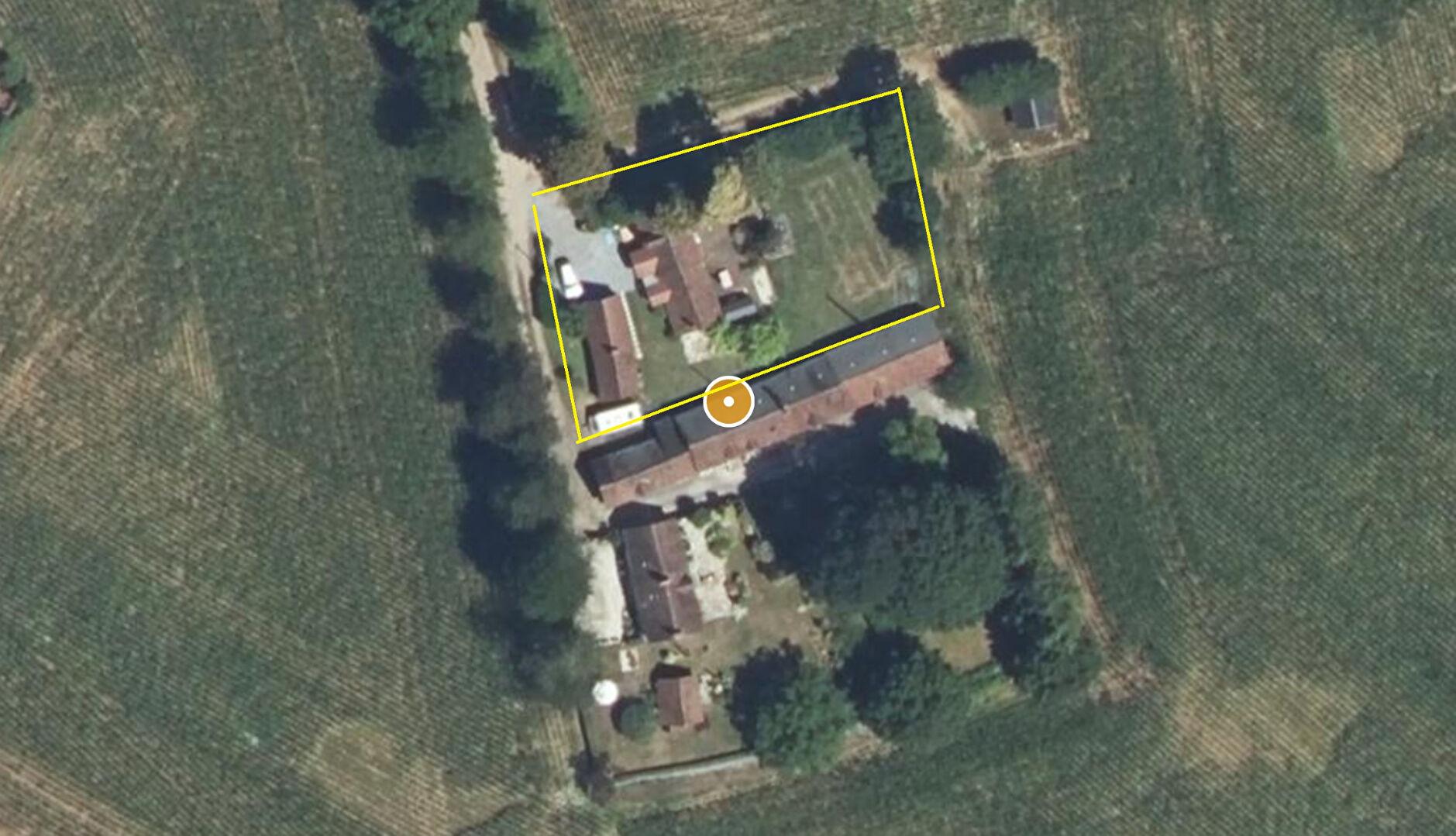 Two-bedroom property in Orne, Normandy, featuring extensive outdoor space and surrounding greenery.