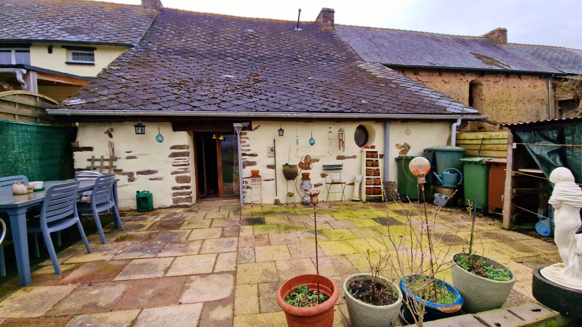 Charming property in Morbihan, Brittany, featuring a light exterior and accessible entrance, ideal for renovation potential.