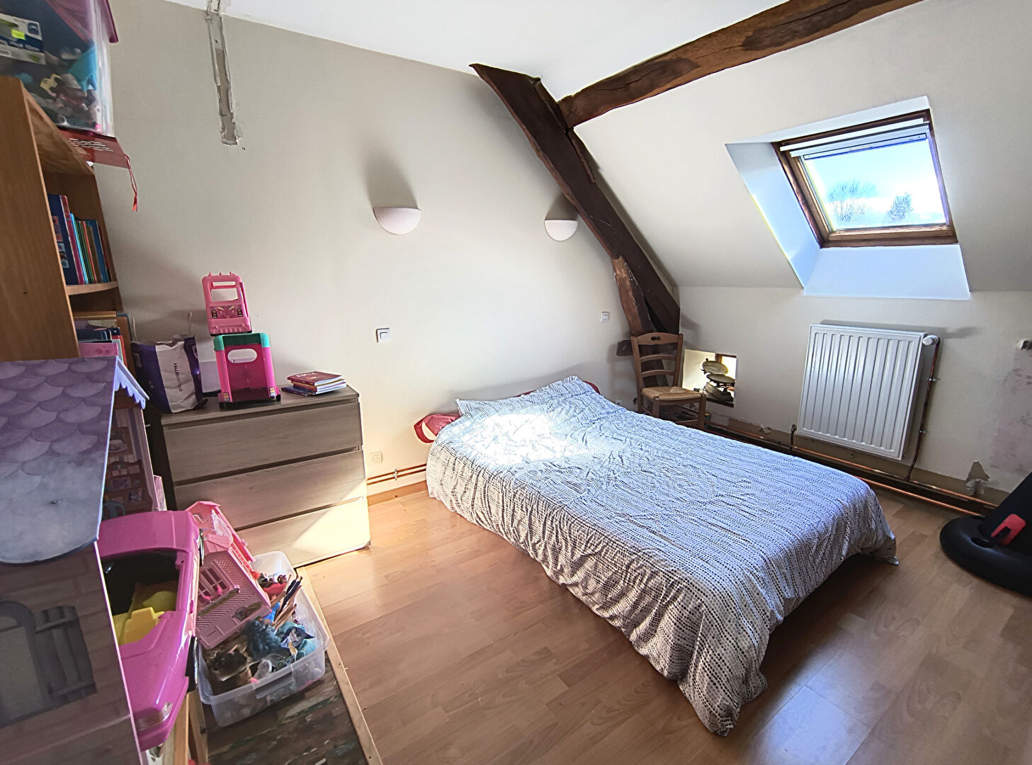 Spacious room with wooden beams and natural light in a property located in Haute-Vienne, Nouvelle-Aquitaine.