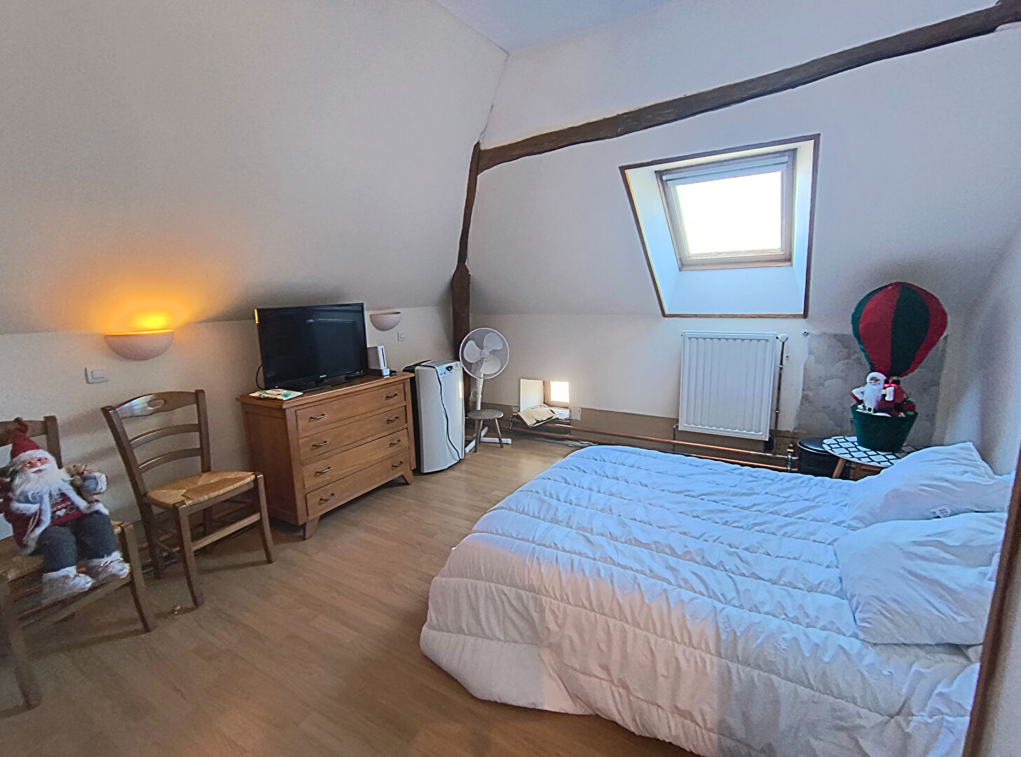 7-bedroom property in Haute-Vienne, Nouvelle-Aquitaine, featuring a bright room with sloped ceiling and wooden accents.