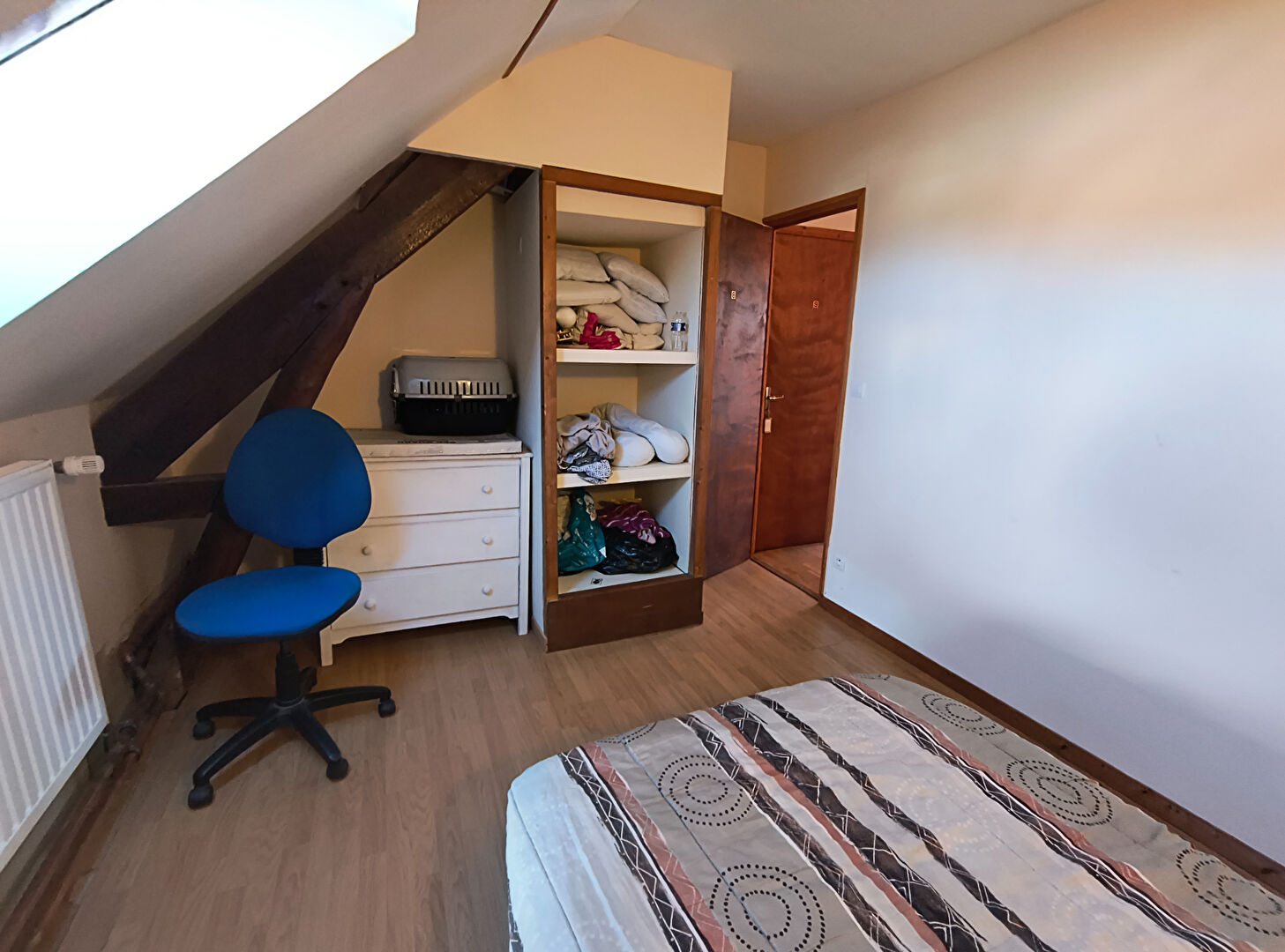 Spacious bedroom in a property located in Haute-Vienne, Nouvelle-Aquitaine, featuring storage and natural light.