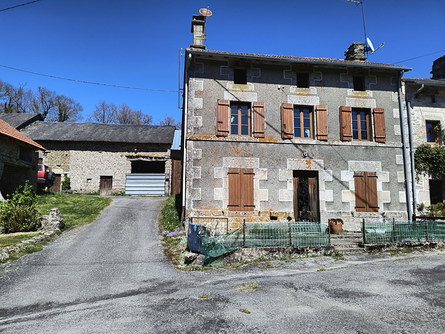 Two-bedroom property in Haute-Vienne, Nouvelle-Aquitaine, featuring a rustic façade and surrounding garden area.