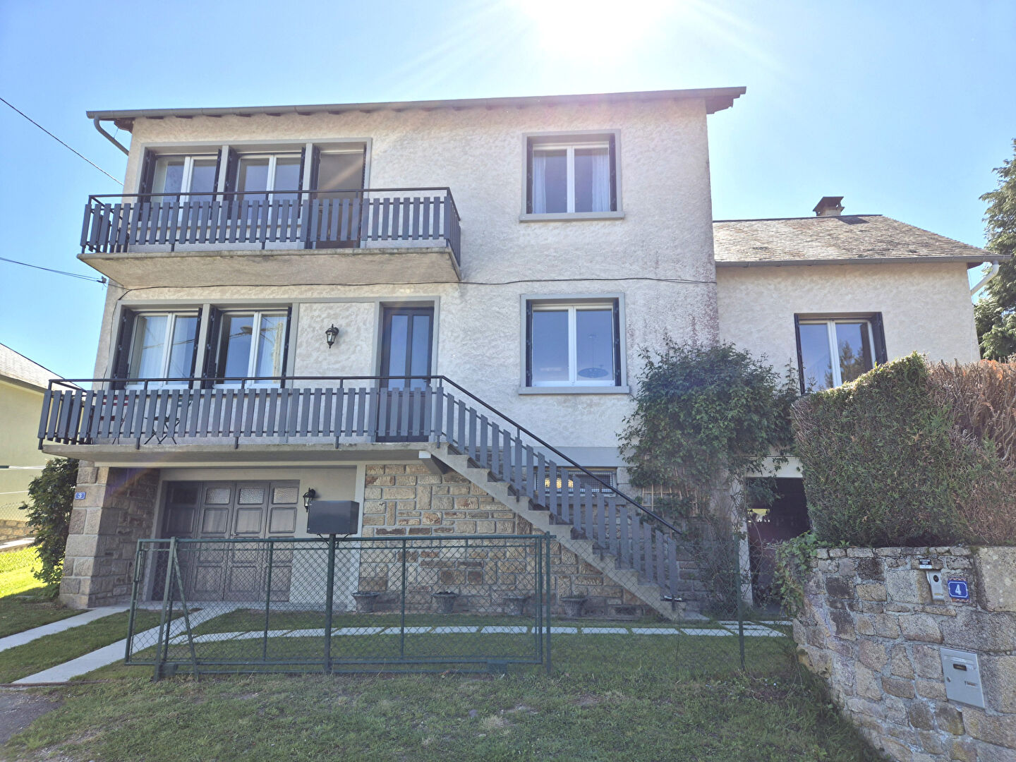 Four-bedroom property in Corrèze, Nouvelle-Aquitaine, featuring balconies and a garden area.