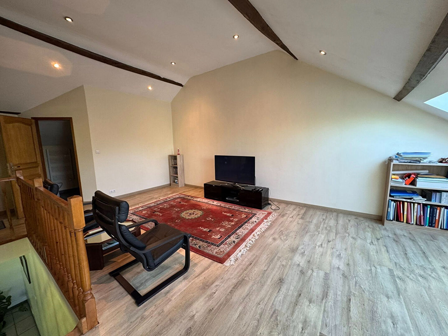 Spacious living area in a property located in Haute-Vienne, Nouvelle-Aquitaine, featuring natural light and wooden beams.