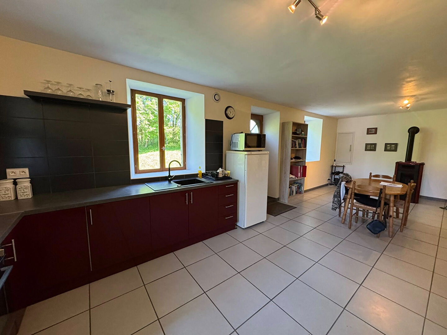 Spacious kitchen in a property located in Haute-Vienne, Nouvelle-Aquitaine, featuring modern appliances and dining area.