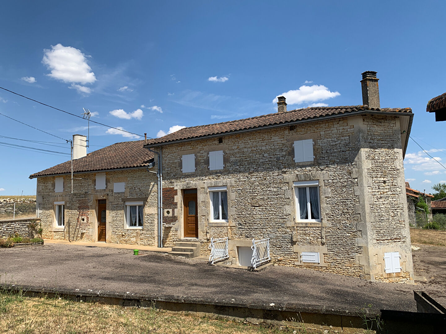 Two-bedroom property in Charente, Nouvelle-Aquitaine, featuring stone exterior and outdoor space.