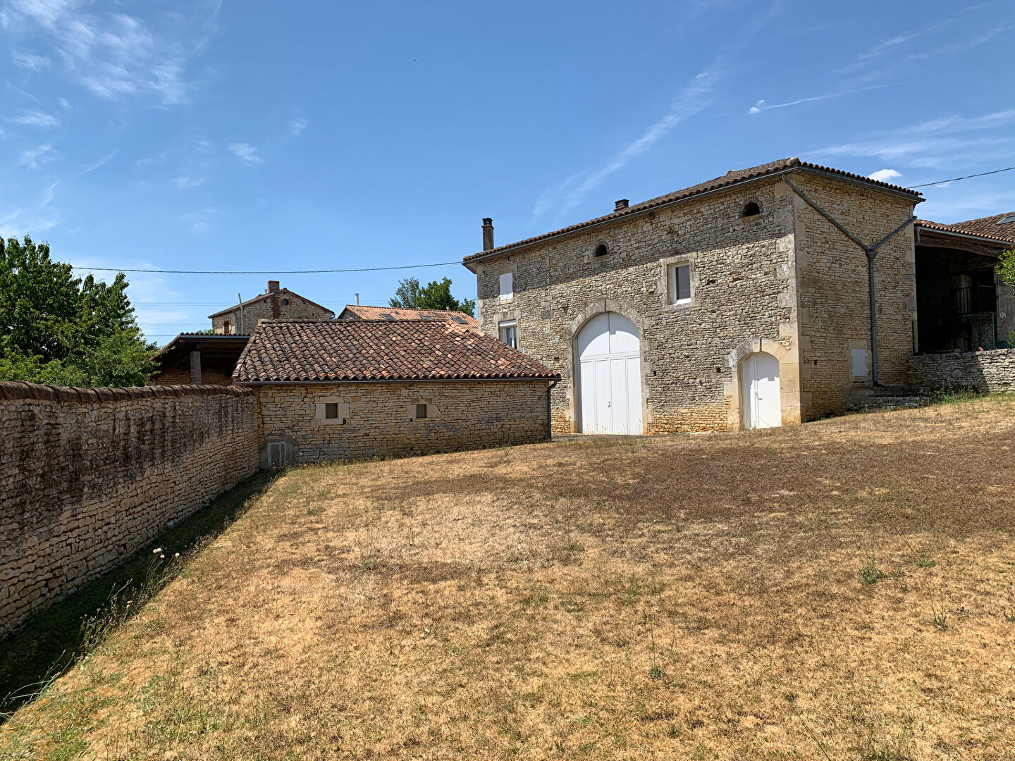 Stone property in Charente, Nouvelle-Aquitaine, featuring a spacious garden and traditional architecture.