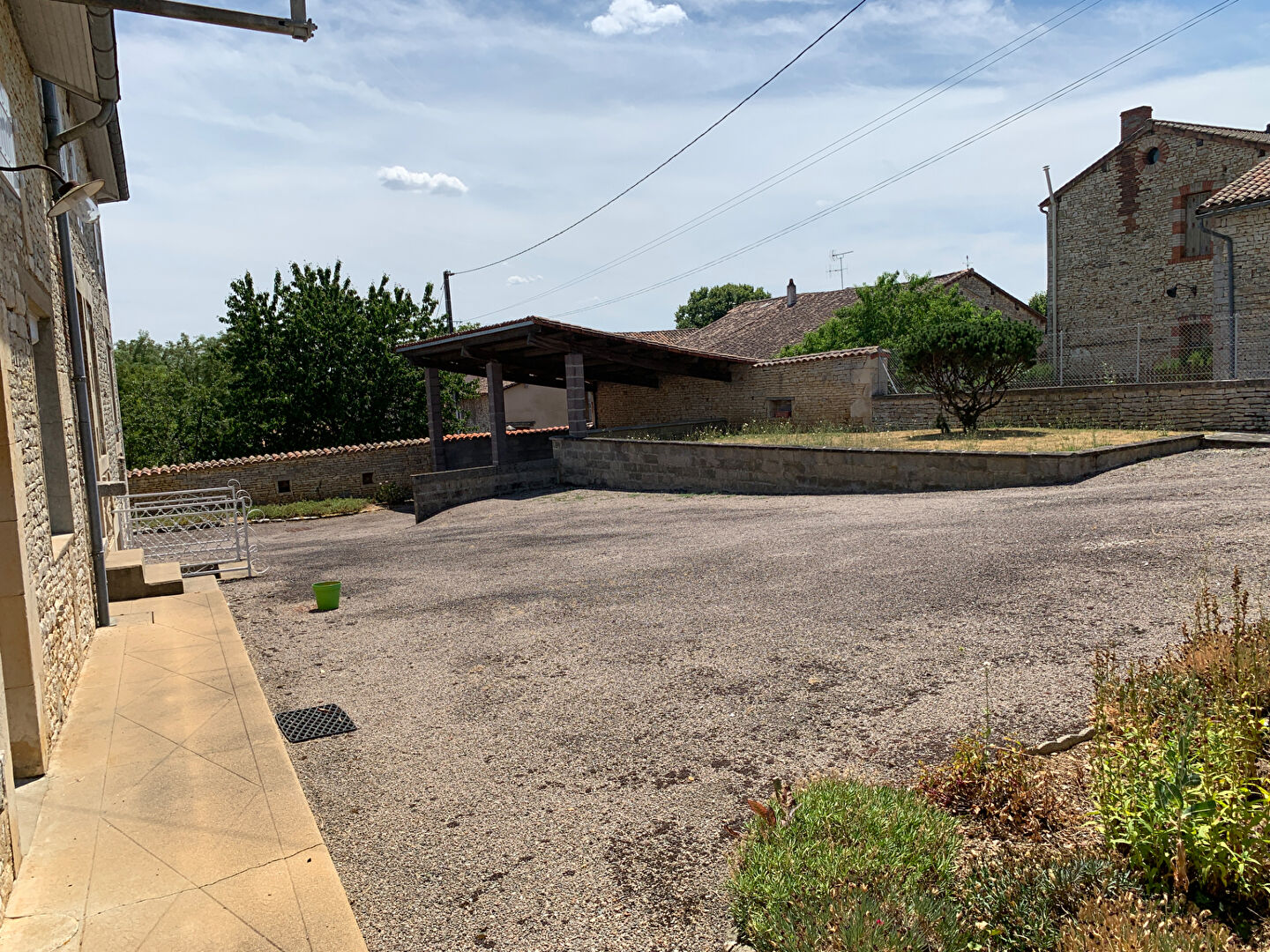 Spacious outdoor area with a covered terrace at the property in Charente, Nouvelle-Aquitaine.