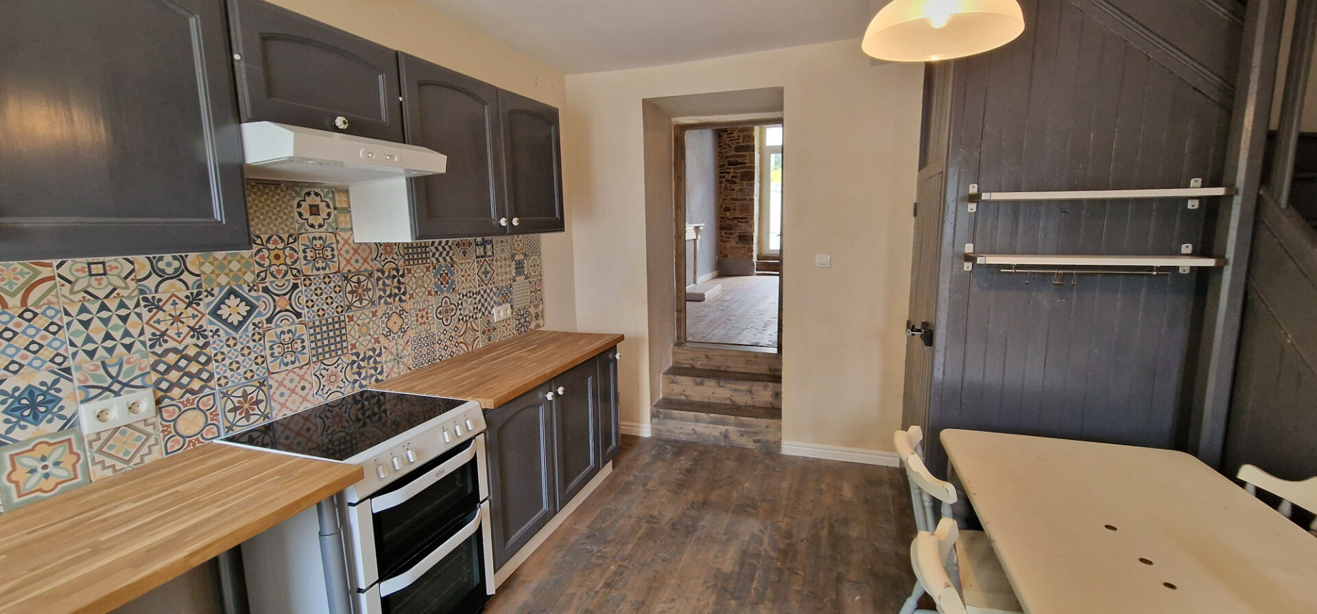 Modern property kitchen featuring grey cabinetry and patterned tiles in Morbihan, Brittany, 56490.