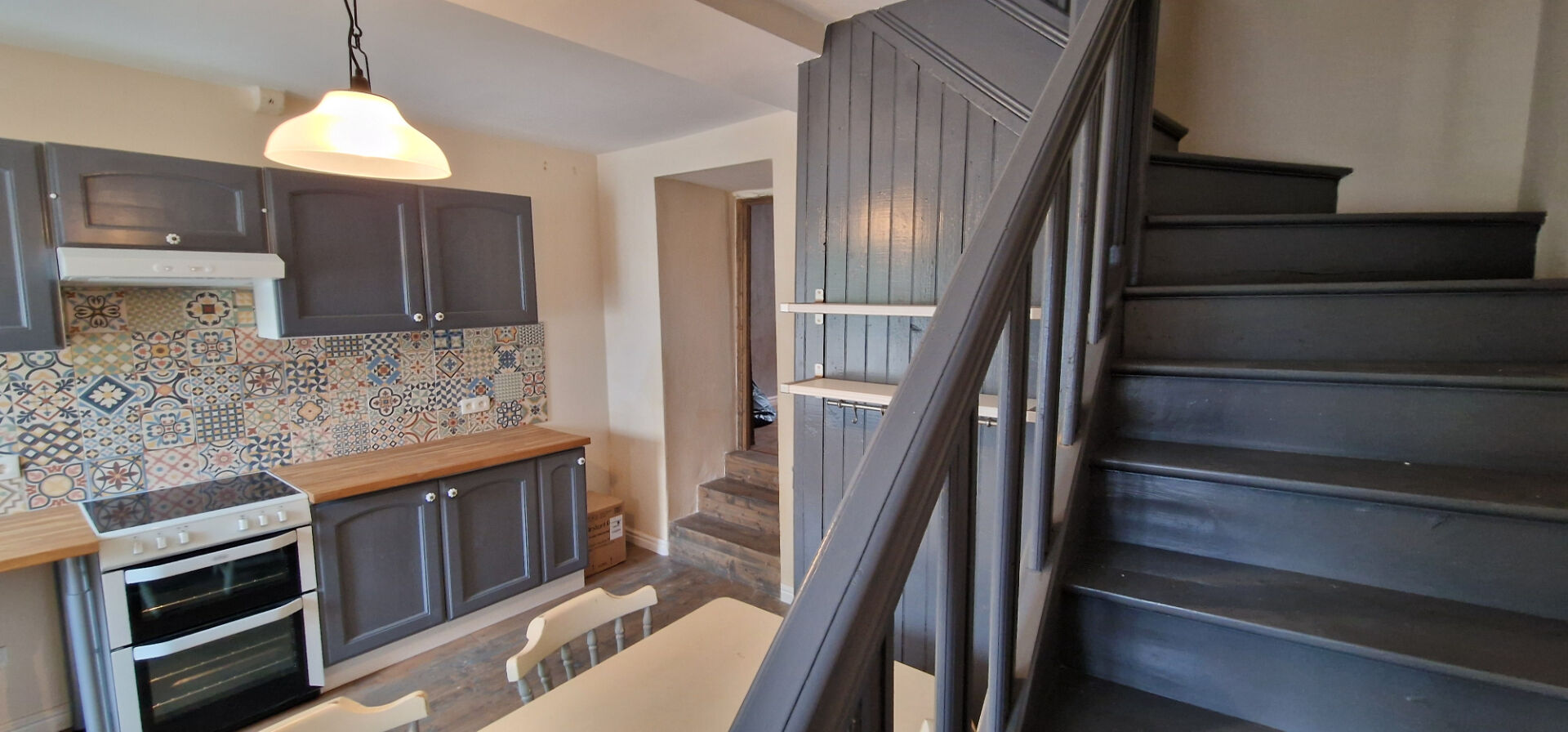 Charming property in Morbihan, Brittany, featuring a modern kitchen and staircase. Ideal for family living.